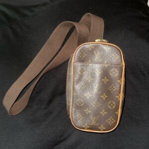 Louis Vuitton belt/bum bag.  Wear across the front of the body or the waist.